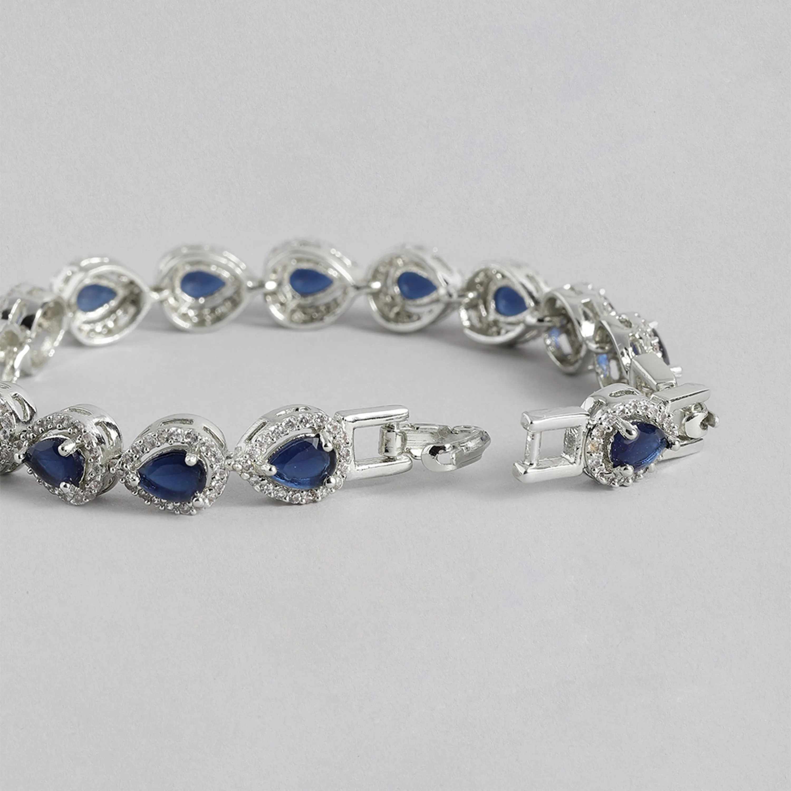 Estele Rhodium Plated CZ Drop Designer Charm Bracelet with Blue American Diamonds for Women