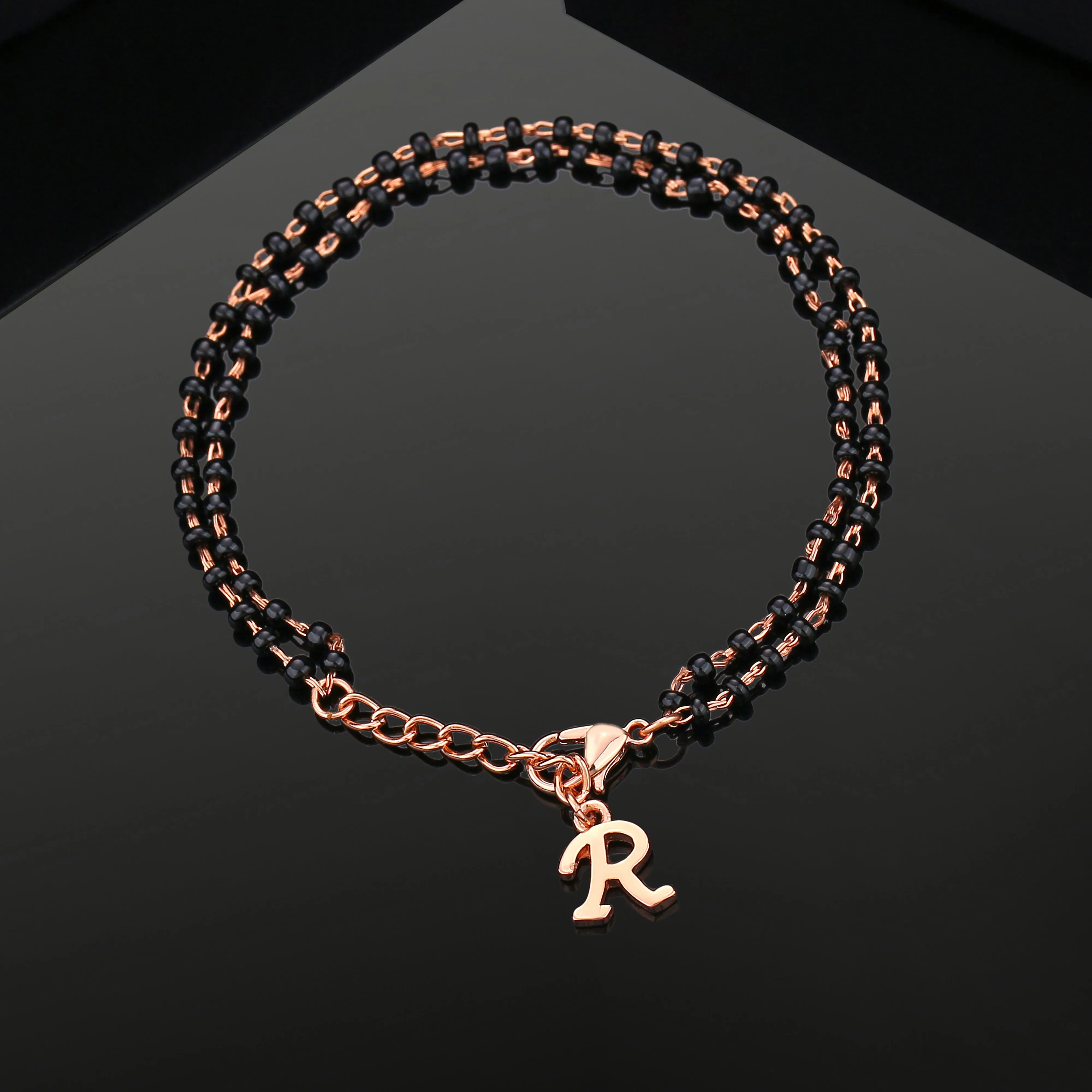Estele Rose Gold Plated Personalized "R" Initial Mangalsutra Charm Bracelet with Black Beads for Women