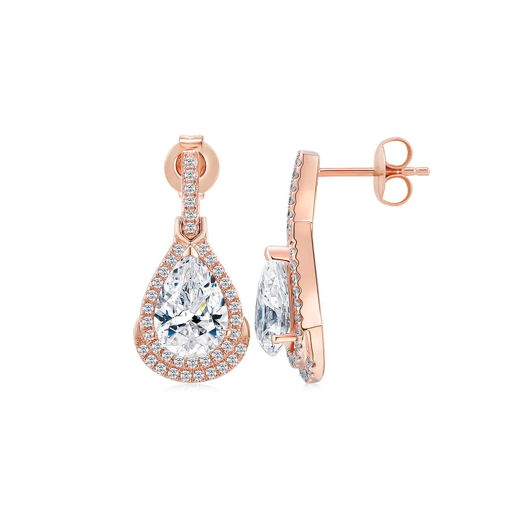 Pear and Round Brilliant halo stud earrings with 3.99 carats* of diamond simulants in 10 carat rose gold