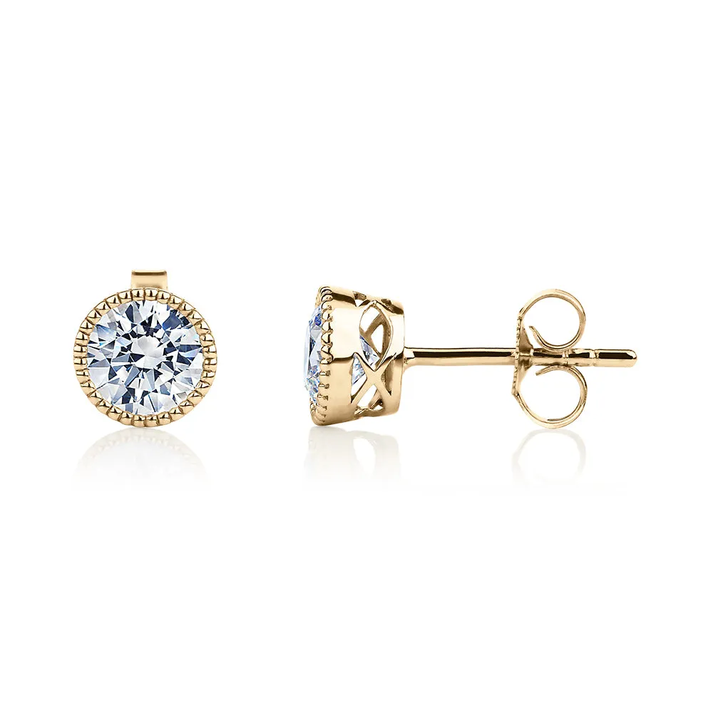 Round Brilliant stud earrings with 1.32 carats* of diamond simulants in 10 carat yellow gold